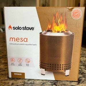 Solo Stove Bronze Mesa tabletop fire pit.